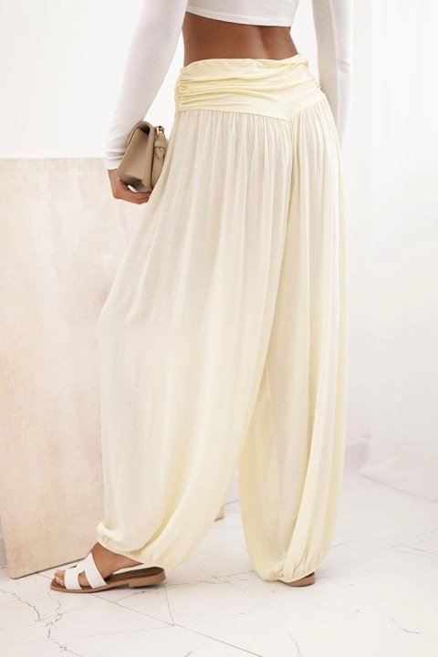 Spodnie damskie wiskozowe z szeroką nogawką i marszczeniami żółte