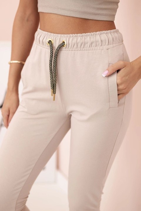 Spodnie dresowe damskie z kieszeniami i wiązaniem w pasie beżowe