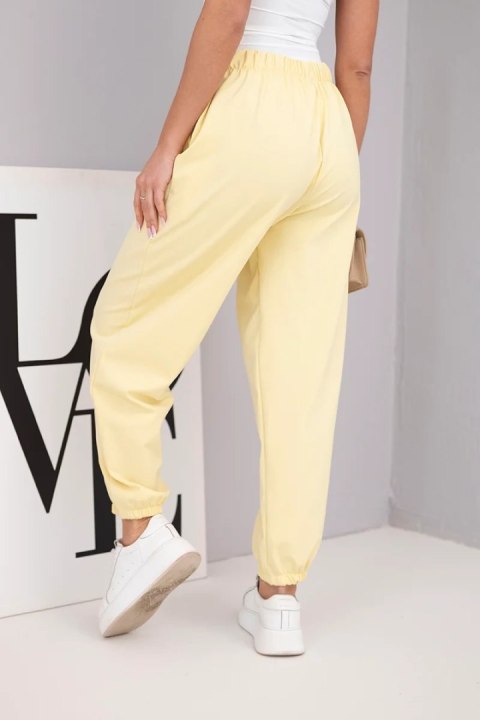 Spodnie damskie bawełniane z wysokim stanem i ozdobnym guzikiem żółte