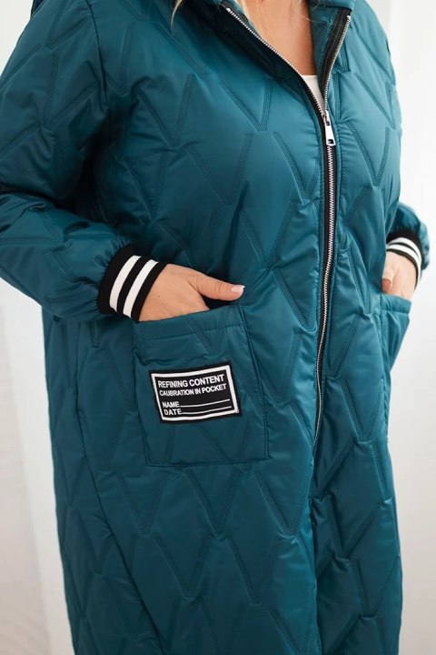 Kurtka damska Plus Size pikowana z kapturem i sportowymi mankietami morska