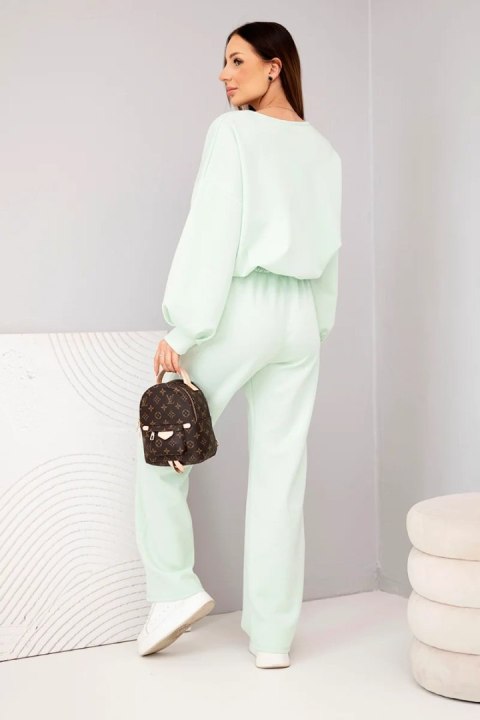 Komplet damski masełko bluza z broszką i spodnie z prostą nogawką miętowy